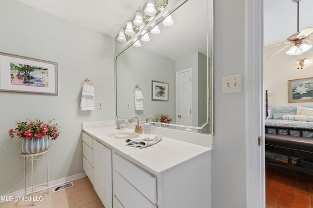 6658 Ahekolo Cir, Diamondhead, MS 39525 - bathroom featuring connected bathroom, vanity, and tile patterned flooring