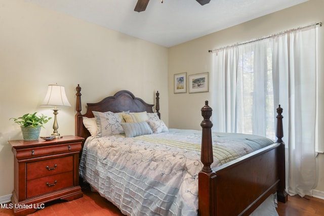 6658 Ahekolo Cir, Diamondhead, MS 39525 - bedroom featuring multiple windows, wood finished floors, and ceiling fan