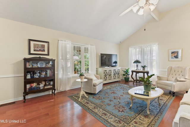 6658 Ahekolo Cir, Diamondhead, MS 39525 - living area featuring a ceiling fan, beamed ceiling, wood finished floors, and high vaulted ceiling