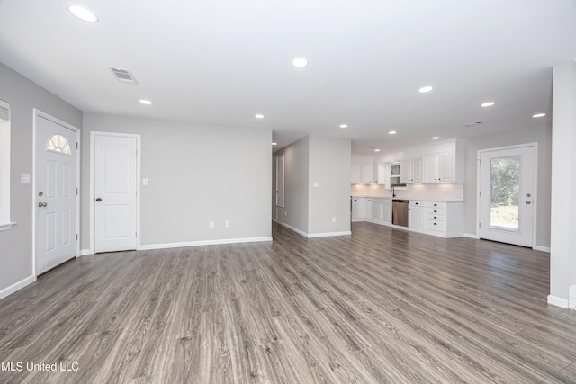 unfurnished living room with light wood-type flooring