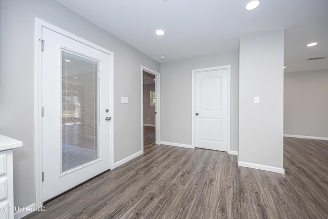 spare room featuring dark hardwood / wood-style flooring