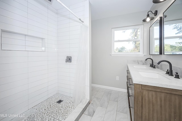 bathroom featuring vanity and walk in shower