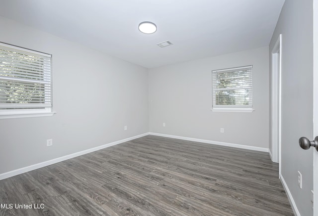 unfurnished bedroom featuring dark hardwood / wood-style floors