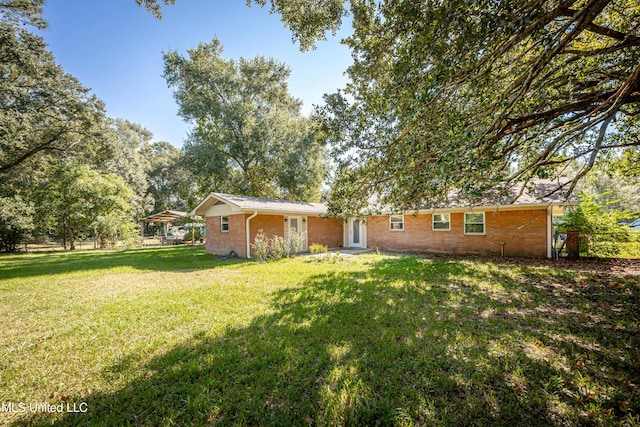 view of front of home with a front yard