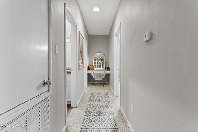 hall with light tile patterned flooring