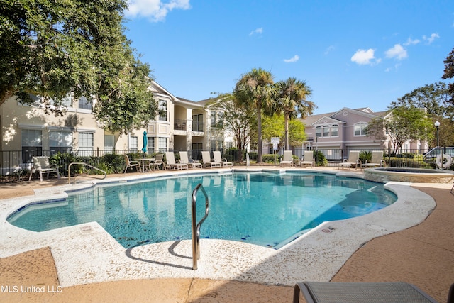 view of pool featuring a patio