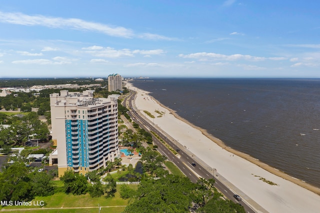 drone / aerial view with a water view and a view of the beach