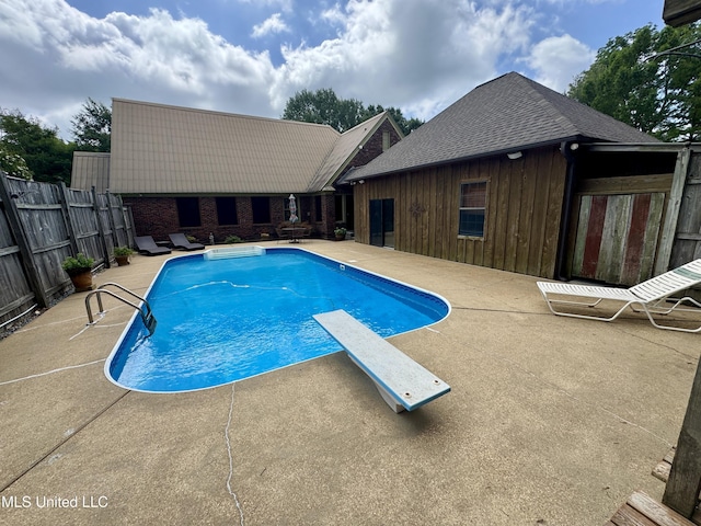 14 Fava St, Alligator, MS 38720 - view of pool with a patio, a diving board, and a fenced backyard