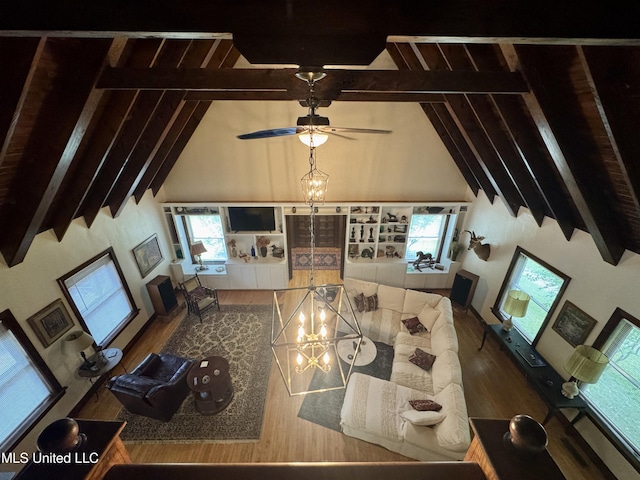 14 Fava St, Alligator, MS 38720 - living room featuring wood finished floors, beam ceiling, high vaulted ceiling, a ceiling fan, and a chandelier