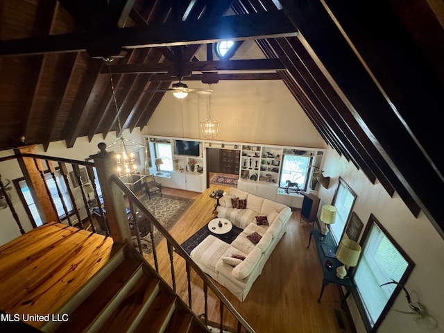 14 Fava St, Alligator, MS 38720 - living room with wood finished floors, beam ceiling, a chandelier, plenty of natural light, and high vaulted ceiling