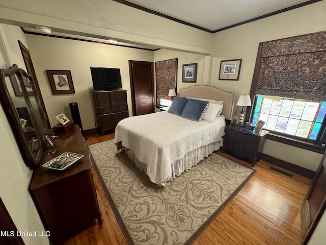 14 Fava St, Alligator, MS 38720 - bedroom with ornamental molding and wood finished floors