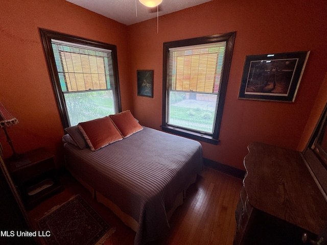 14 Fava St, Alligator, MS 38720 - bedroom featuring wood finished floors and multiple windows