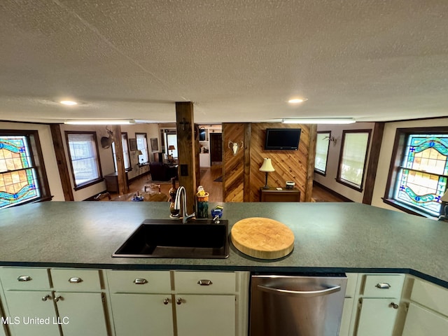 14 Fava St, Alligator, MS 38720 - kitchen with a textured ceiling, dark countertops, and stainless steel dishwasher