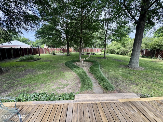 14 Fava St, Alligator, MS 38720 - fenced backyard featuring a wooden deck