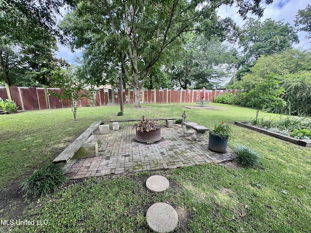 14 Fava St, Alligator, MS 38720 - fenced backyard with a patio and a fire pit