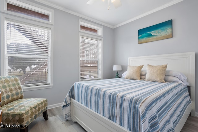 bedroom featuring ceiling fan, light hardwood / wood-style floors, and ornamental molding