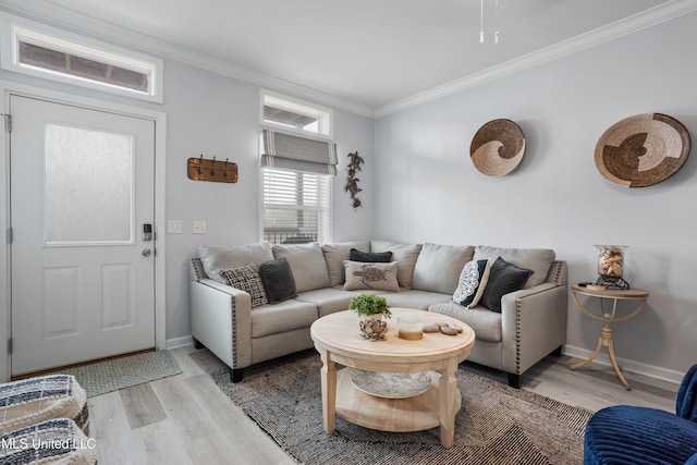 living room featuring light hardwood / wood-style floors and ornamental molding