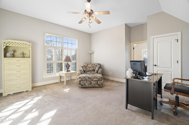 carpeted office with vaulted ceiling and ceiling fan