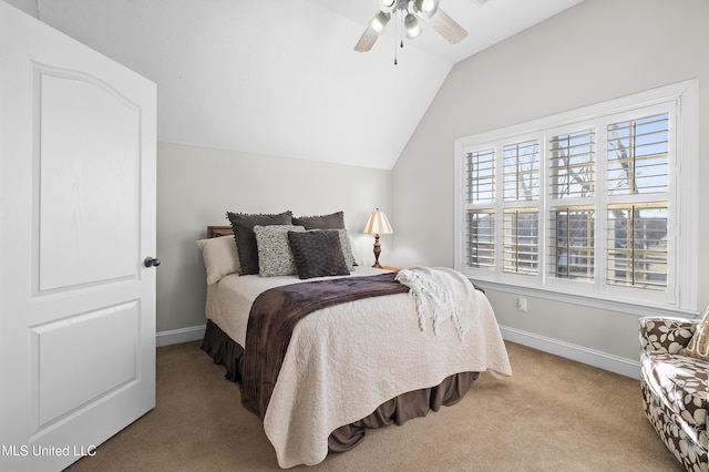 bedroom with multiple windows, ceiling fan, lofted ceiling, and light carpet