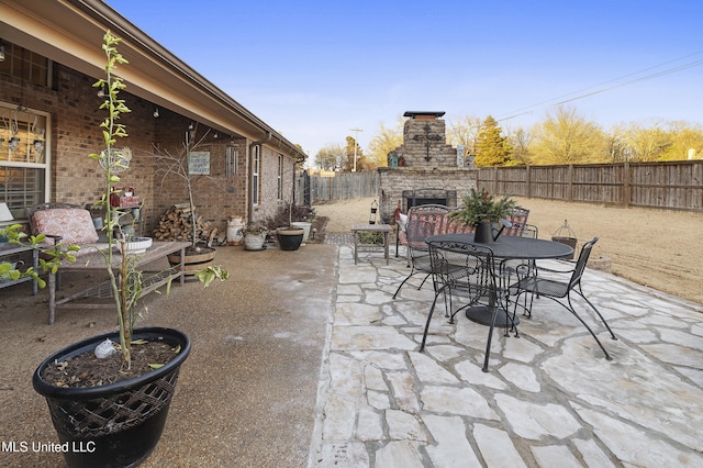 view of patio / terrace with an outdoor stone fireplace