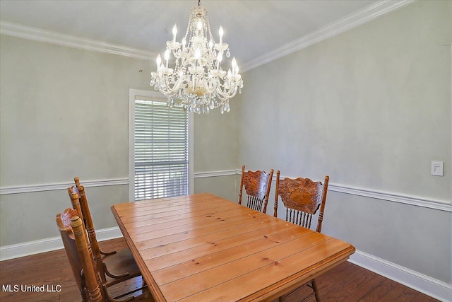 dining area with crown molding, dark hardwood / wood-style flooring, and a chandelier