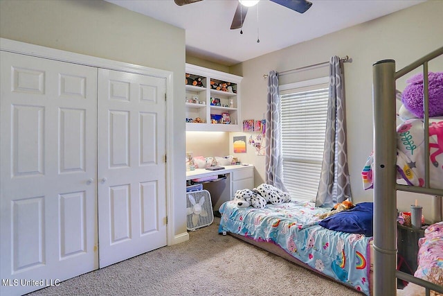 carpeted bedroom with a closet and ceiling fan