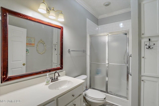 bathroom featuring vanity, toilet, crown molding, and walk in shower