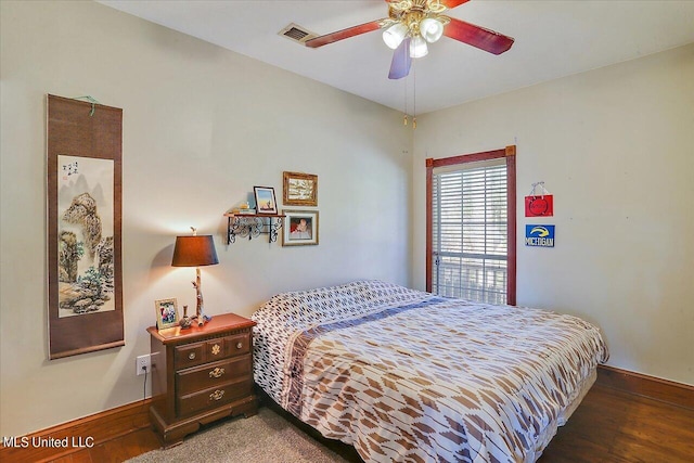 bedroom featuring dark wood-type flooring and ceiling fan