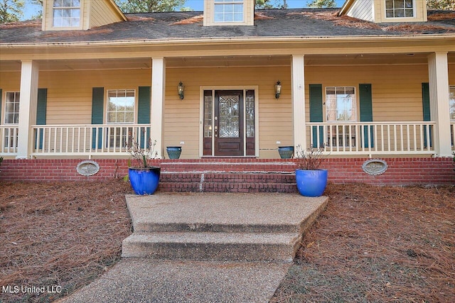 property entrance with a porch