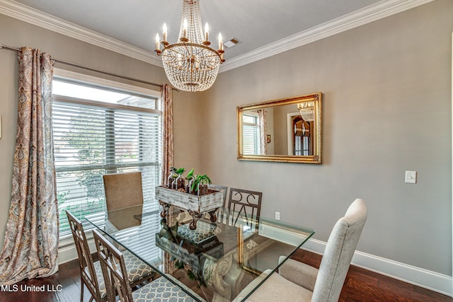 dining area featuring baseboards, visible vents, ornamental molding, wood finished floors, and a chandelier