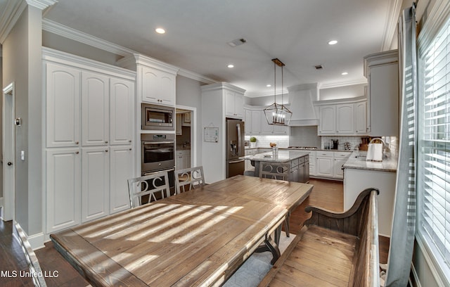 dining room featuring ornamental molding, a chandelier, dark wood-style flooring, and recessed lighting