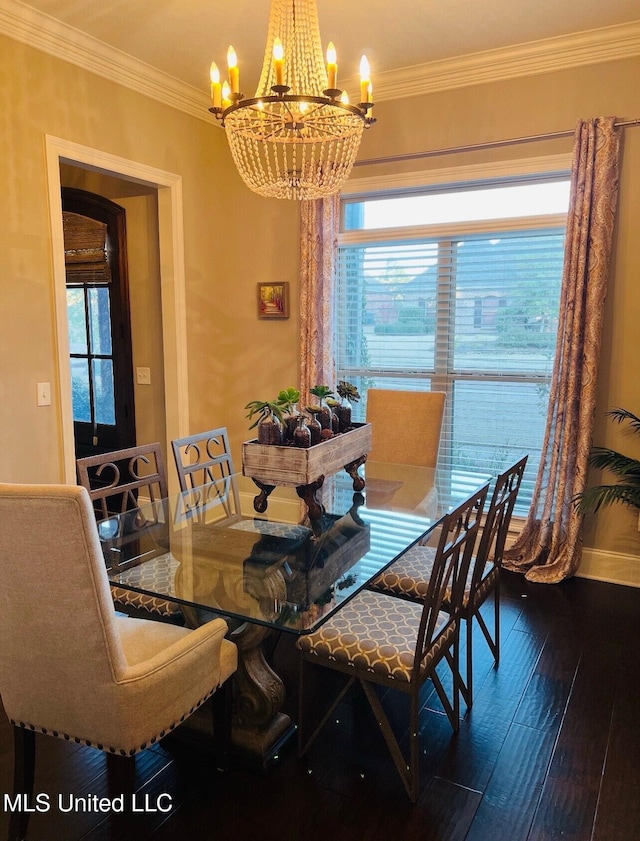 dining room featuring ornamental molding, wood finished floors, and a notable chandelier