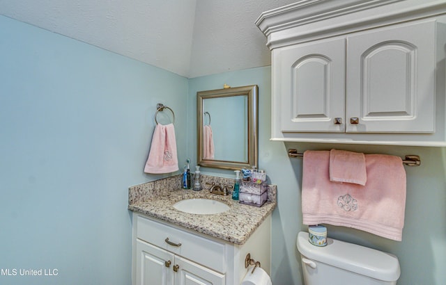 half bath with vanity and toilet