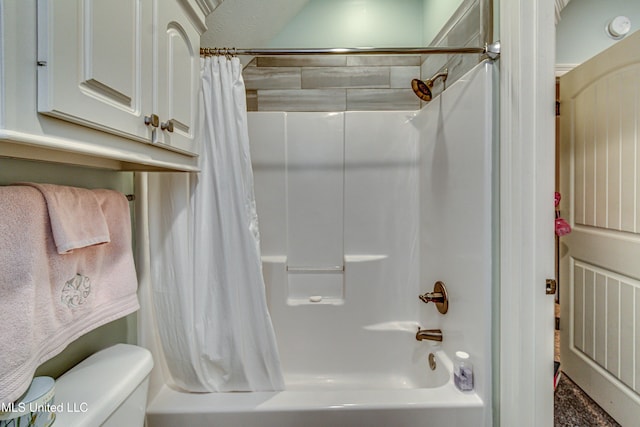 full bathroom with visible vents, shower / bath combo, and toilet