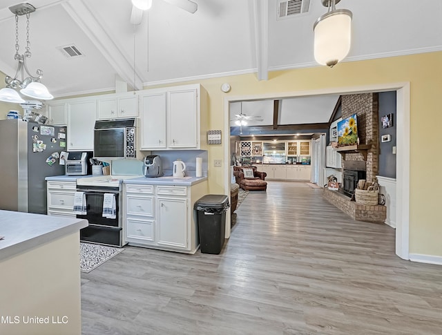 kitchen featuring black microwave, ceiling fan, electric range, visible vents, and freestanding refrigerator