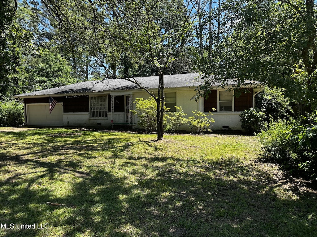 2238 Alta Woods Ter, Jackson, MS 39204 - view of front facade featuring an attached garage, a front lawn, and crawl space
