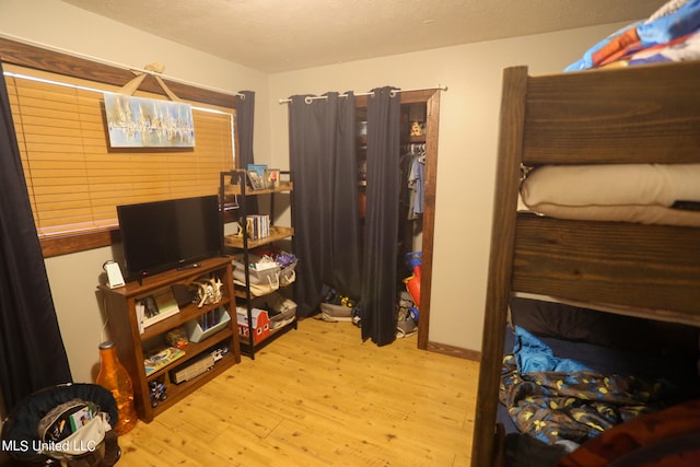 bedroom with light hardwood / wood-style floors