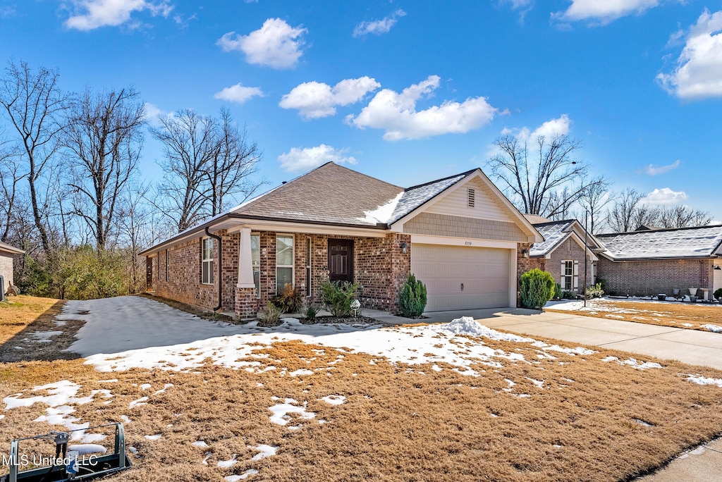 ranch-style home featuring a garage