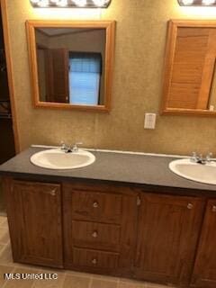 bathroom featuring vanity and tile patterned flooring