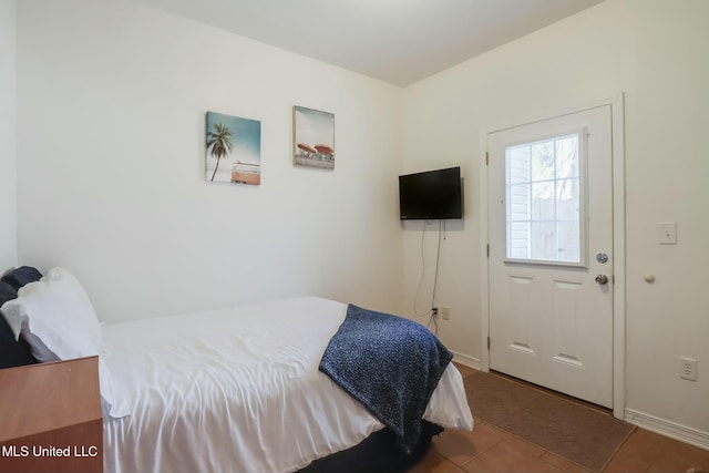 tiled bedroom with baseboards