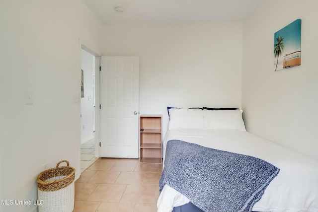 bedroom with light tile patterned floors