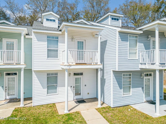 view of front of house with a balcony