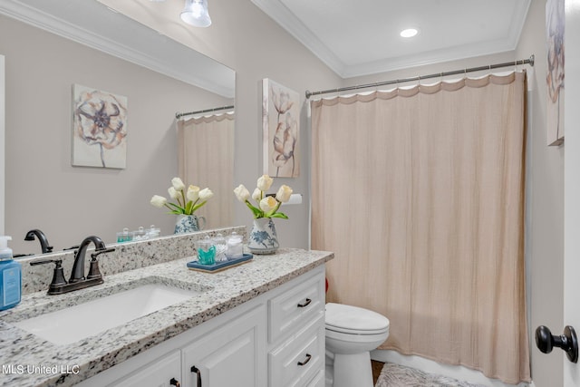 bathroom with vanity, ornamental molding, and toilet