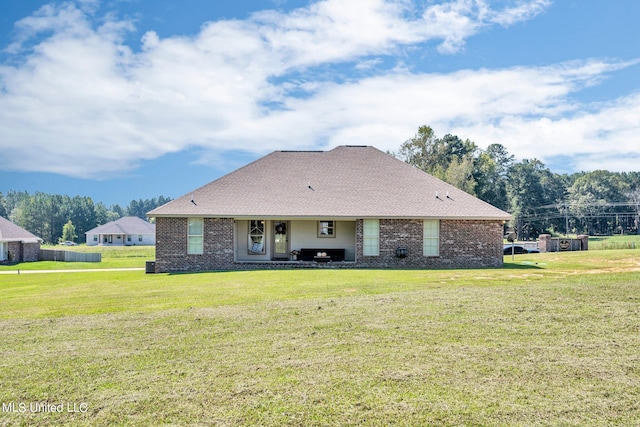 view of front of home with a front lawn