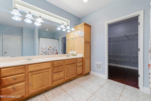 bathroom featuring vanity and tile patterned flooring