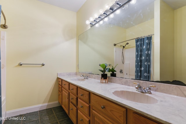 bathroom with vanity, curtained shower, and tile patterned floors