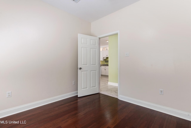 spare room featuring light wood-type flooring