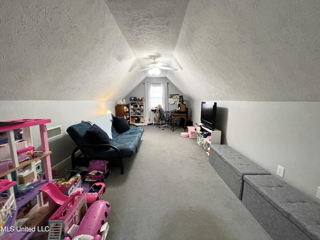 playroom with carpet flooring, vaulted ceiling, and a textured ceiling