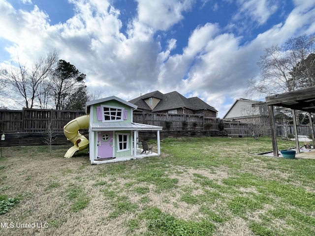 view of yard with a playground