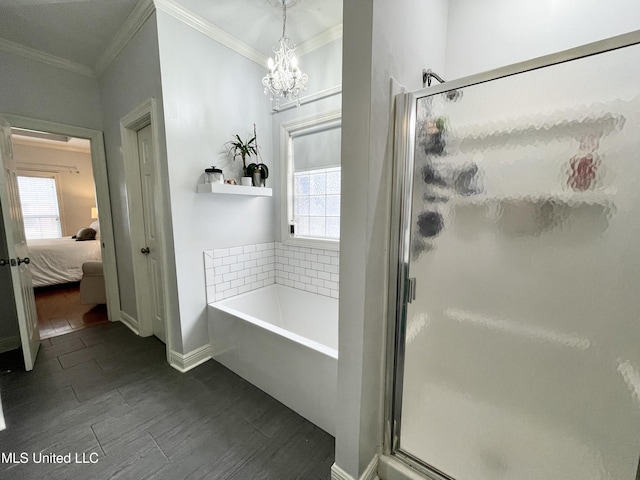 bathroom with plus walk in shower, a wealth of natural light, and crown molding